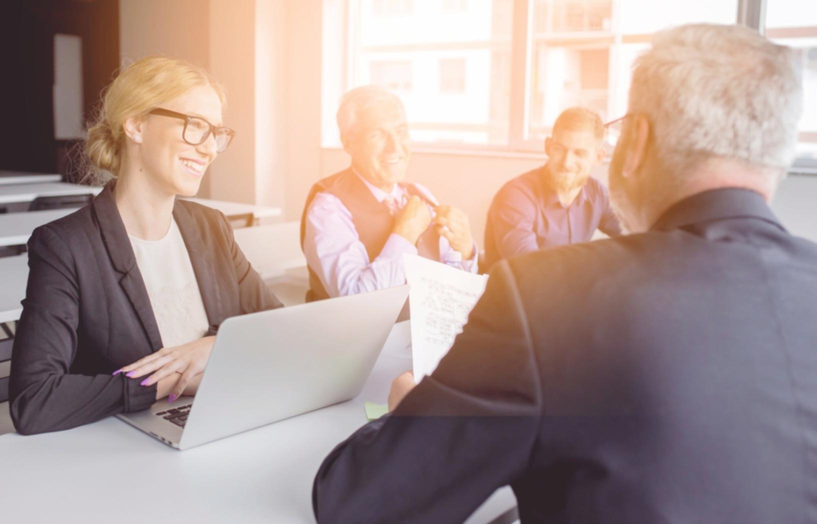 modern office setting with team monitoring current optimization projects across different industries