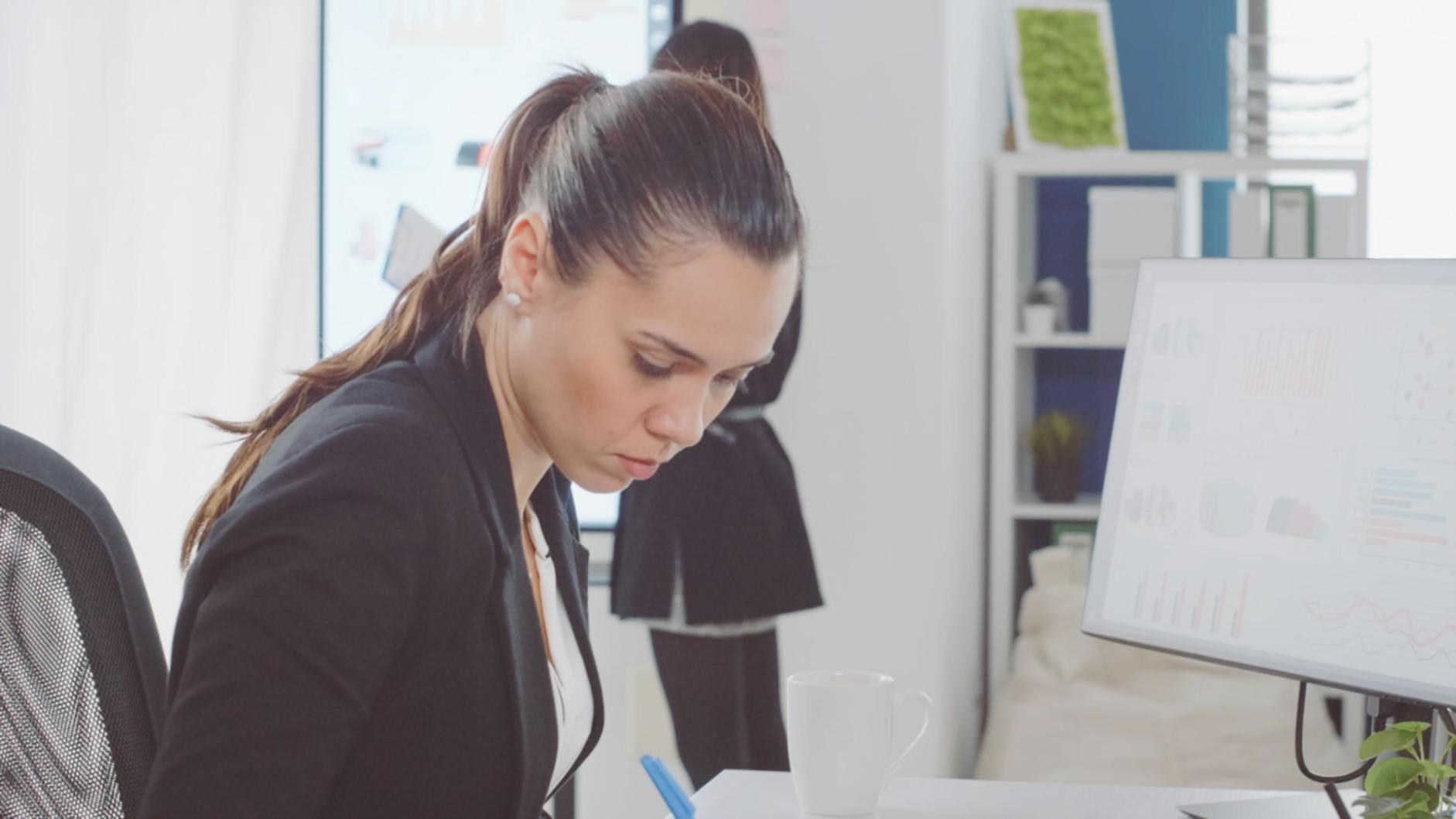 early office workspace with team analyzing website metrics and traffic patterns