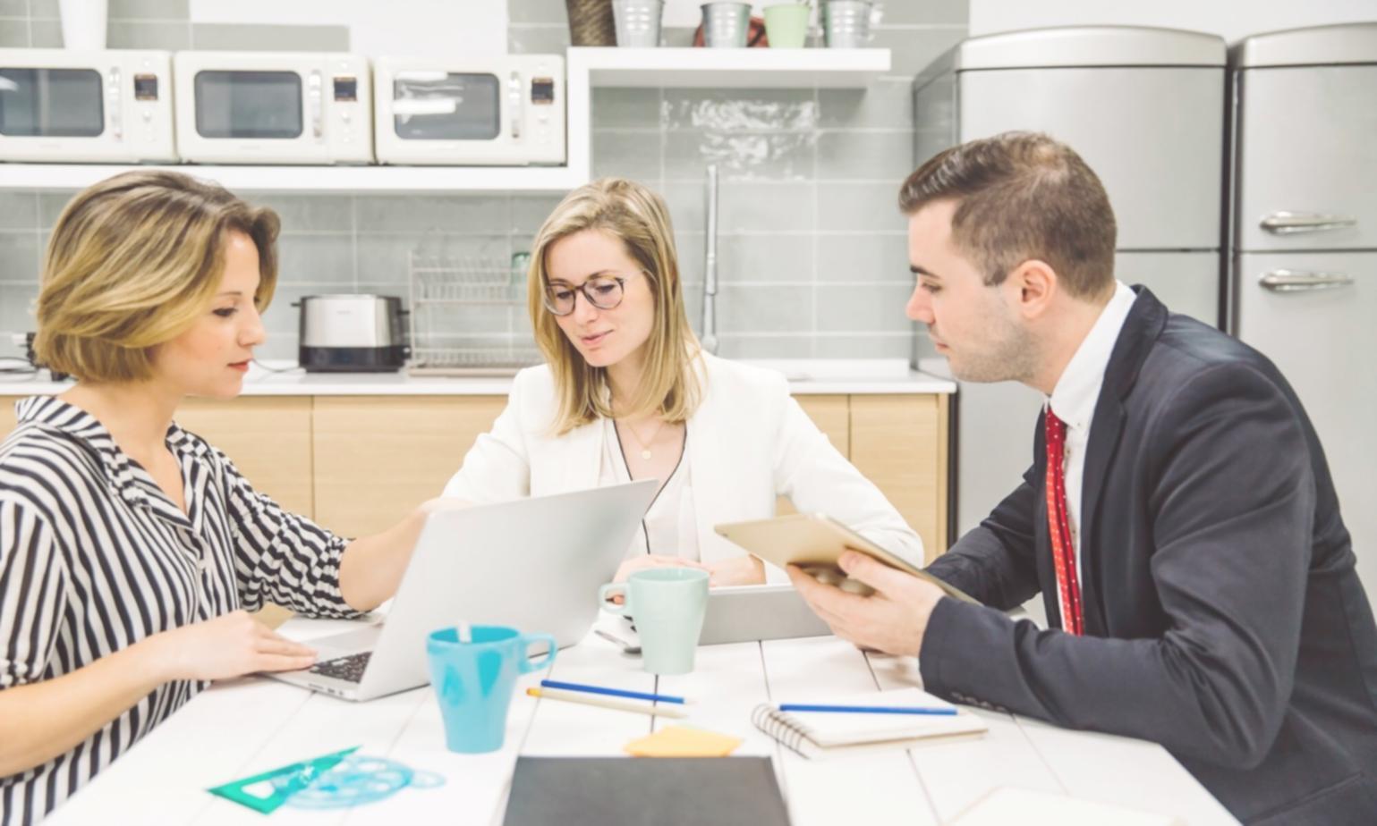 Team analyzing website traffic patterns on multiple screens
